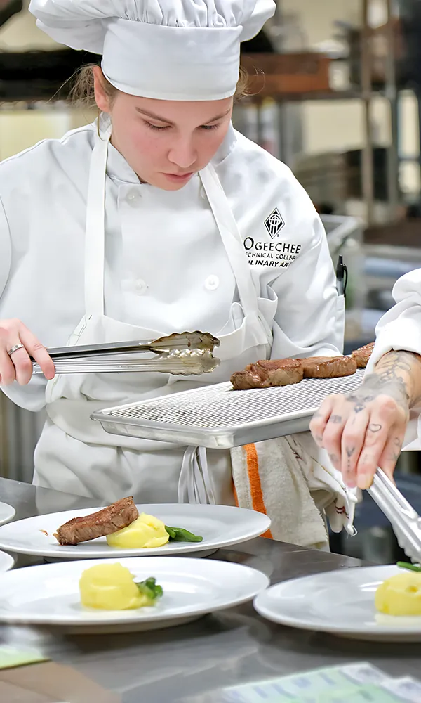 Culinary students plating food