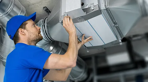 Air conditioning repairman at work