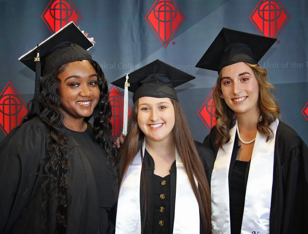 OTC students posing for picture at graudation