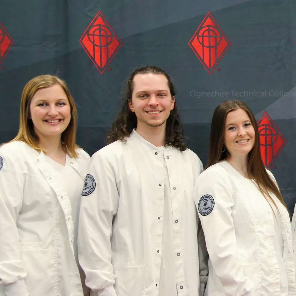 OTC students posing for picture in labcoats